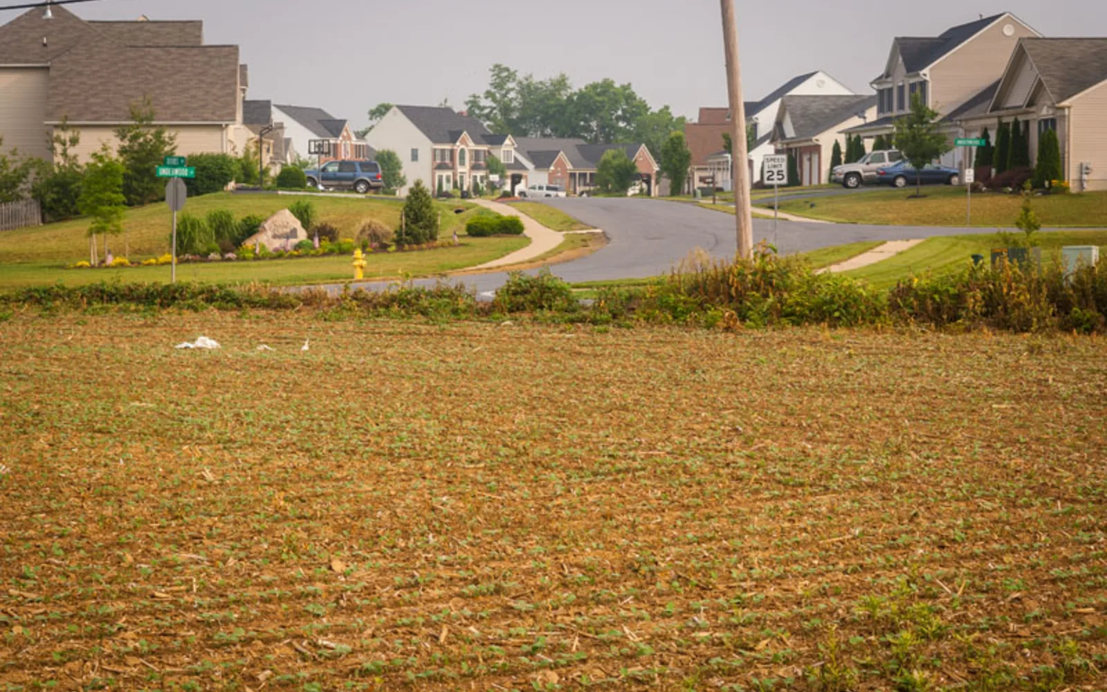 Suburban housing development expanding across former farmland